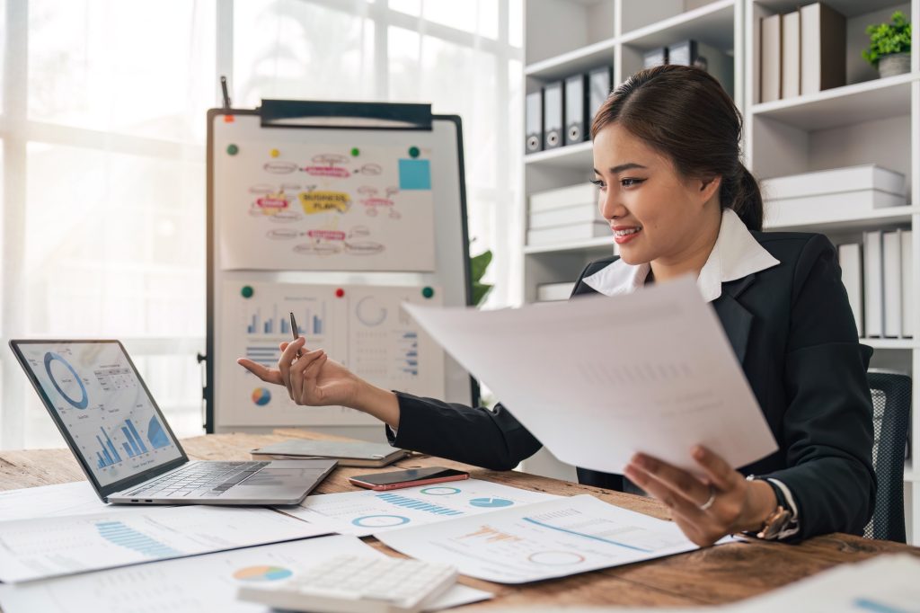 bookkeepers asia business woman working on tax consultant finance in a modern office. Make an