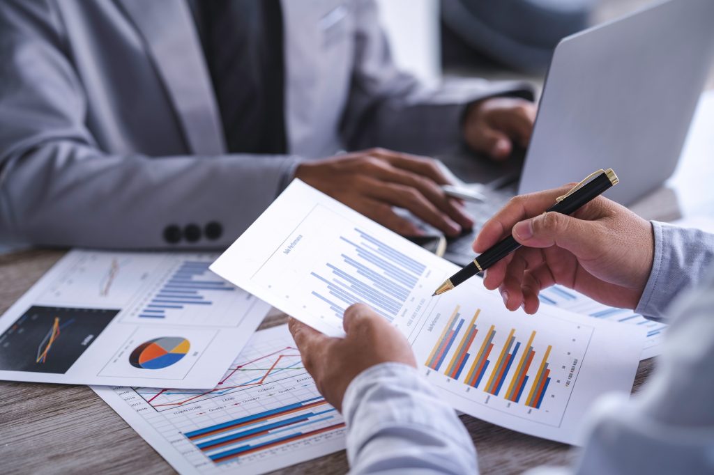 Finance manager meeting discussing company growth project success financial statistics, professional
